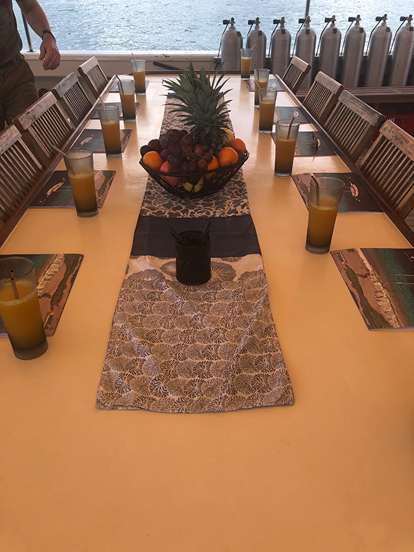 The table on deck of the Emperor Raja Laut - Raja Ampat